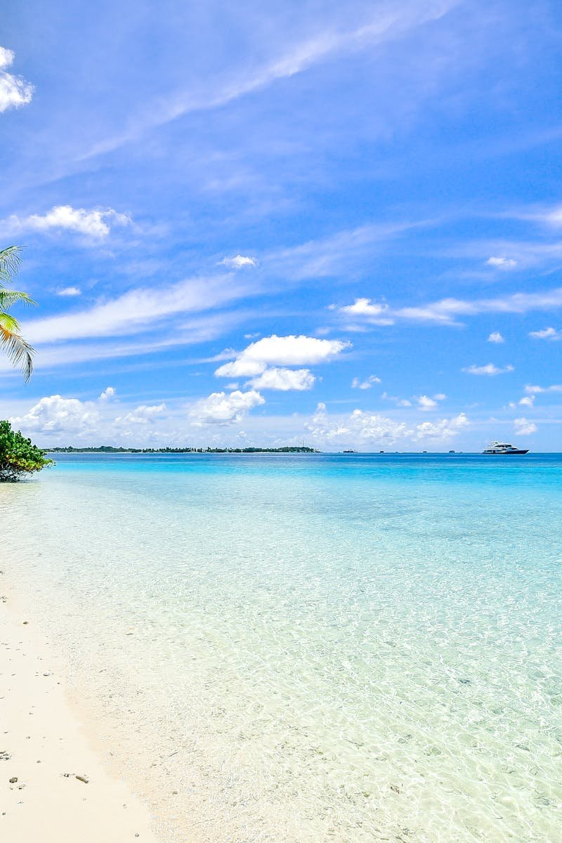 Stunning beach in Laamu Atoll, Maldives, with turquoise waters and clear skies.
